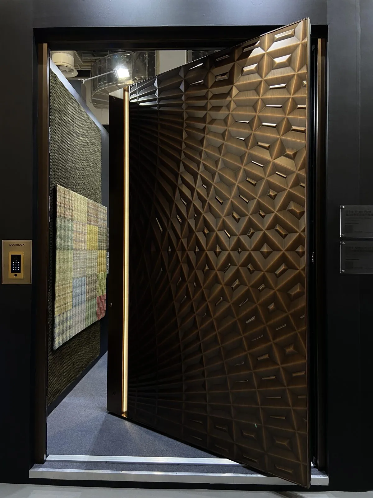 Deep diagonal lattice relief in dark bronze, with a slim vertical light line.