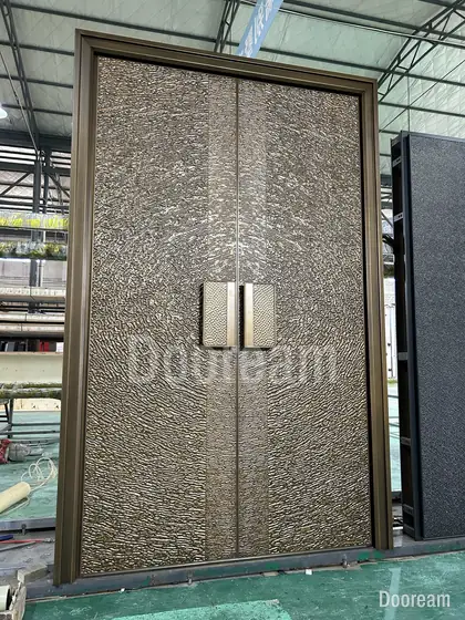 Hammered bronze double door, photographed on our floor