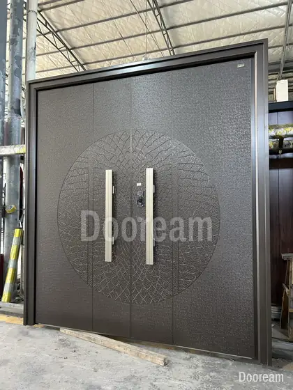 Grey double door with a circle relief, photographed on our floor