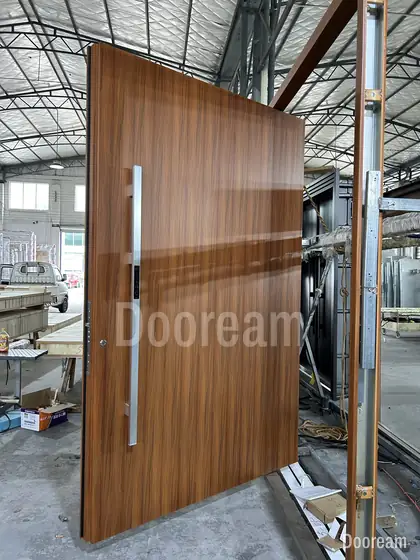 Walnut pivot door, photographed on our floor