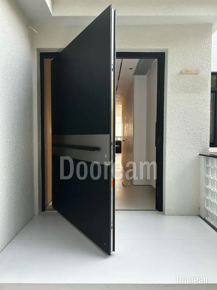Black door with a wide silver band, above outdoor steps, installed