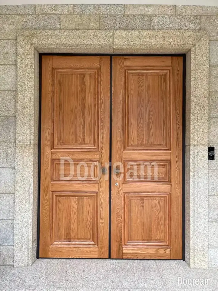 Classic wood-tone double door with round handles, installed