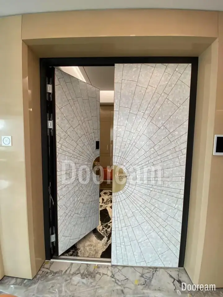 White radial-pattern double door with a gold centrepiece, installed