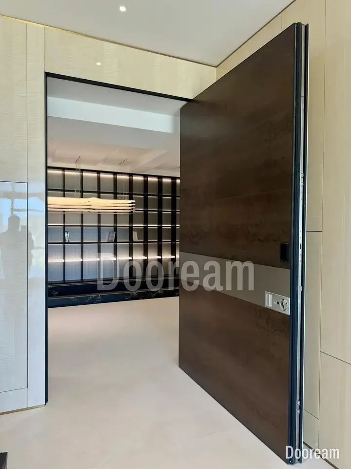 Dark wood-tone door with a wide metal band, installed