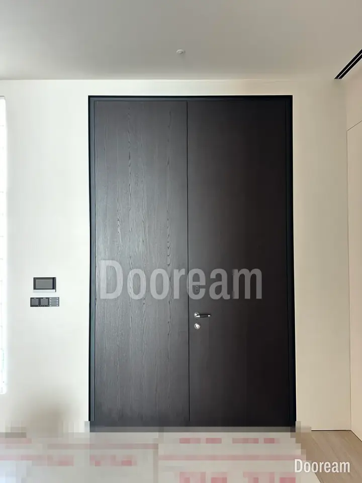 Dark wood-grain door with a pale or timber surround, installed