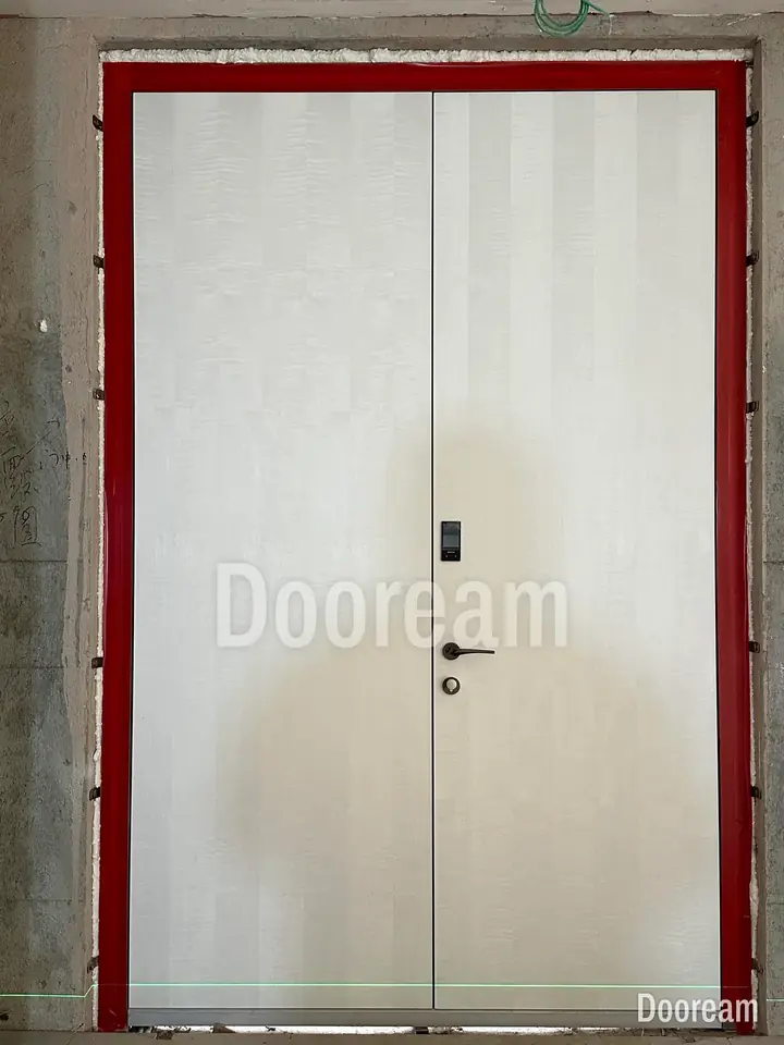 White unequal double door with vertical lines, installed