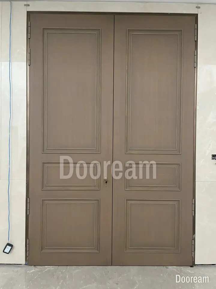 Tall classic double door in light brown, installed