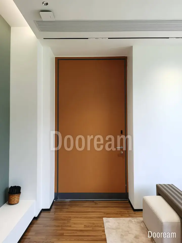 Simple single door in orange-brown, installed