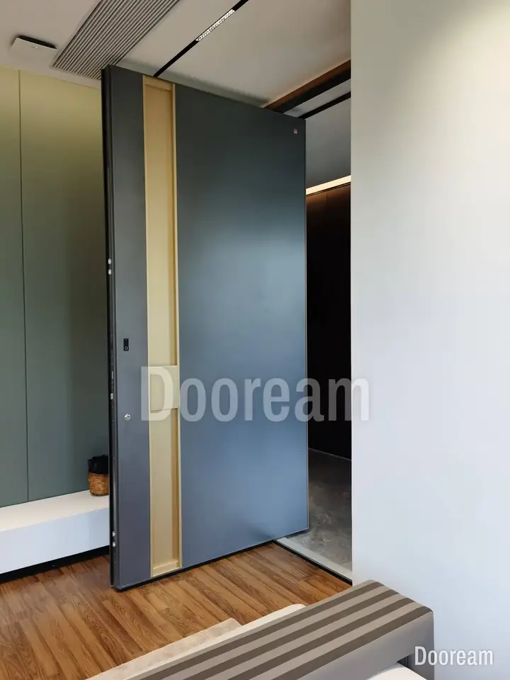 Dark-grey door with a vertical timber-tone strip, by a timber-floored step, installed